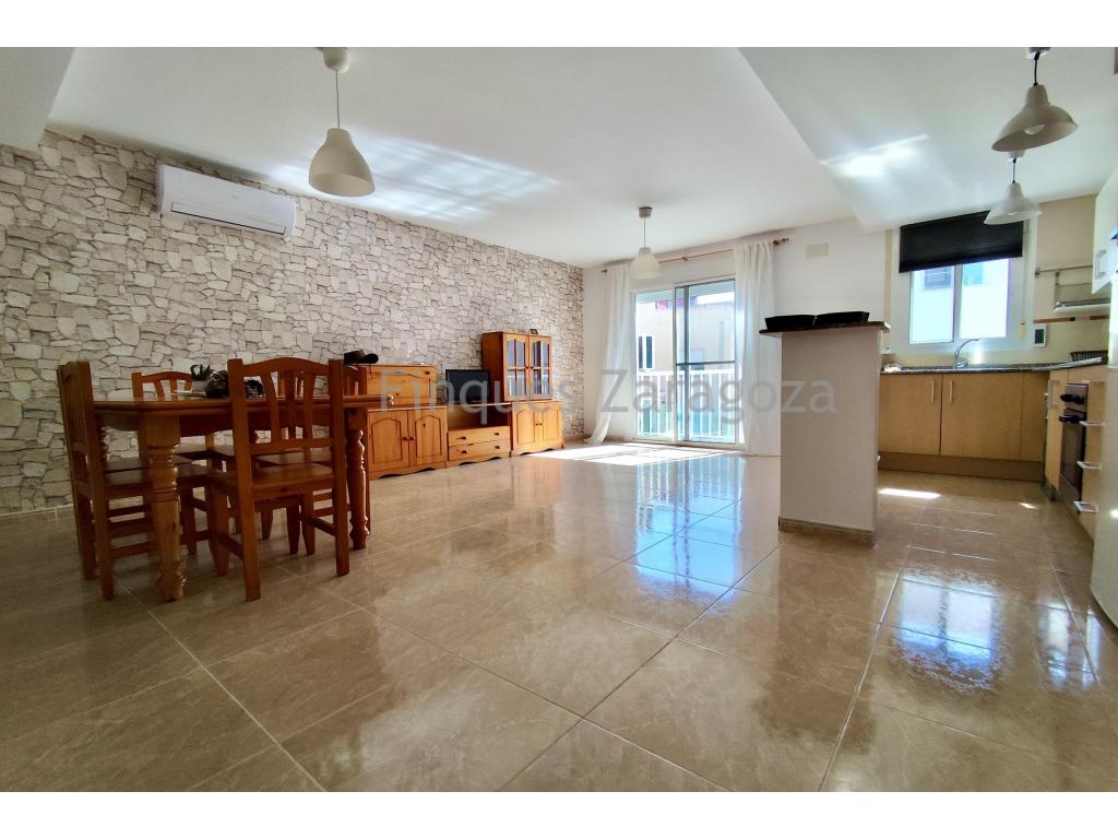 The Sant Jaume Duplex is a spacious, bright home, perfect for enjoying a peaceful setting. It is located in a charming village where the essence of community life is still alive: neighbors greet each other, and residents enjoy an authentic small-town lifestyle.The property is part of a building with only six apartments, ensuring privacy and tranquility. It also includes a covered parking space, and the building is equipped with an elevator.Upon entering the duplex, you are welcomed by a spacious entrance hall that leads into a large open-plan living and dining area with an integrated kitchen. Thanks to its large windows, this space enjoys abundant natural light throughout the day. On this same floor, there is also a single bedroom and a guest toilet.A comfortable staircase leads to the upper floor, where the sleeping area is located. Here you will find one double bedroom, two single bedrooms, and a full family bathroom.The master bedroom provides access to a pleasant interior patio, ideal for bringing in additional natural light, hanging laundry, or simply enjoying a quiet moment outdoors. With 112 m² of built area, a parking space included, and a peaceful location, this duplex offers everything needed to become the perfect home. If you are looking for space, comfort, and quality of life at an excellent price, this is an opportunity you should not miss.