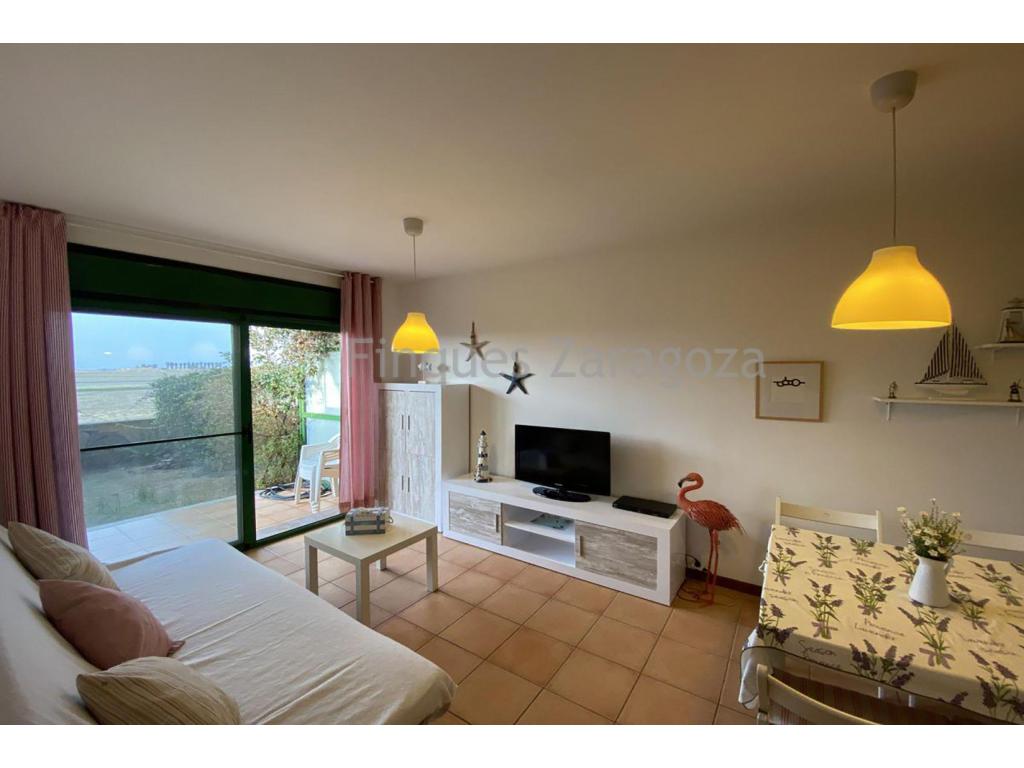Beautiful ground-floor apartment in the Ebro Delta, in the Eucaliptus residential development, Amposta, Costa Dorada.Located just a 2-minute walk from the beach.The property features 2 double bedrooms with built-in wardrobes, a bathroom with a shower, a cupboard housing the washing machine and water heater, an open-plan kitchen and a living-dining room.Private terrace and garden with afternoon sunshine and spectacular views of the Delta.Fully furnished. Equipped with air conditioning. Parking space in the same building.The stated price does not include the expenses and taxes arising from the transfer of ownership, such as notary, land registry and administrative fees, or any applicable taxes (Property Transfer Tax, Value Added Tax or Stamp Duty), all of which shall be borne entirely by the purchaser in accordance with current legislation.Real estate agency fees are included in the agreed sale price.To determine and consult the applicable tax regime, please visit the website of the Catalan Tax Agency: https://atc.gencat.cat/ca/tributsThe information contained in this advertisement is provided for information and guidance purposes only and does not constitute a binding offer or contract under any circumstances. Finques Zaragoza Immobiliaria Delta de l’Ebre, SL, reserves the right to modify, update or correct the content of this advertisement at any time without prior notice.