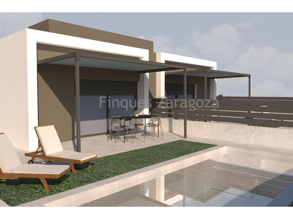 Villas under construction on the beach of Riumar (Deltebre), in the Ebro Delta.These villas are located in a quiet area, 3 minutes walk from the promenade and 1,5km from the nautical port and the Ebro River.Each villa has a plot of 300m² and a constructed area of 89m². They are distributed internally in kitchen with lounge/dining room, 3 double bedrooms and 2 bathrooms; one of the bathrooms is for private use of the double bedroom. To the rear is the 22,5m² swimming pool, topped with artificial grass, plants and a LED panel at the bottom of the front wall which gives privacy to the pool area and the pool at night. The villas have a skylight in the hallway and bathrooms, giving plenty of light during the day.Aluminium windows with double glazing that insulate from the outside temperature, thus achieving comfort inside the villa. Air conditioning (hot/cold) and fans in all rooms.The villas will be delivered with all the furniture and electrical appliances.