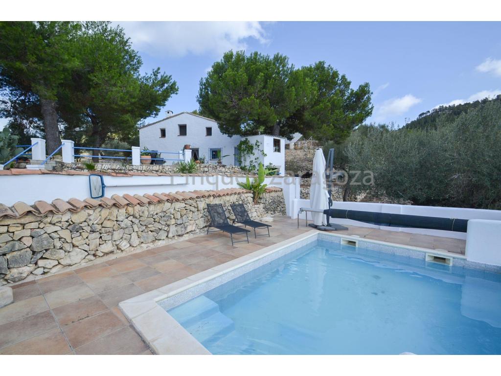 This beautiful finca is located in the area of Perello, 8km from the town of l'Ampolla and the beach, in a quiet and noise free area.The plot has 37.472m² of land and is planted with olive trees, carob trees and various fruit trees.The road to the finca is completely asphalted. Once we arrive at the finca, there is a private road which leads directly to the houses.The first house we find on the left hand side is a listed farmhouse from 1913. It has 141,61m² constructed and 94,71m² usable. It has been completely renovated and is distributed internally in kitchen, lounge/dining room, a room used as an office and bathroom on the ground floor. Stairs lead to the first floor where we find another bathroom with bathtub and three double bedrooms. From the main bedroom we have access to a porch terrace.It is equipped with gas cooker and boiler, heating by gasoil radiators and fireplace.The second house, built on a lower level than the first one, has a more modern style. It has 127,46m² constructed area and 89,47m² usable area. In the lower part of the house we find the kitchen, through interior stairs we access to the hallway and from here to the living room of the house which gives access to a bedroom, and again from the hallway, to the other two bedrooms and bathroom. All the rooms, except the bathroom and the small bedroom (the one next to the living room), have access from the outside. The house has plenty of natural light.It is equipped with gas cooker and boiler, double glazed aluminium windows and water heating system from the fireplace.Attached to the house, there is a small storeroom which is currently used as a laundry room.The roof of both houses is gable with Arabic tiles.Outside there are several storage rooms and a swimming pool overlooking the rest of the property.The property is not in production.It has electricity by means of solar panels and batteries.It has water from a cistern (23.000 litres capacity).